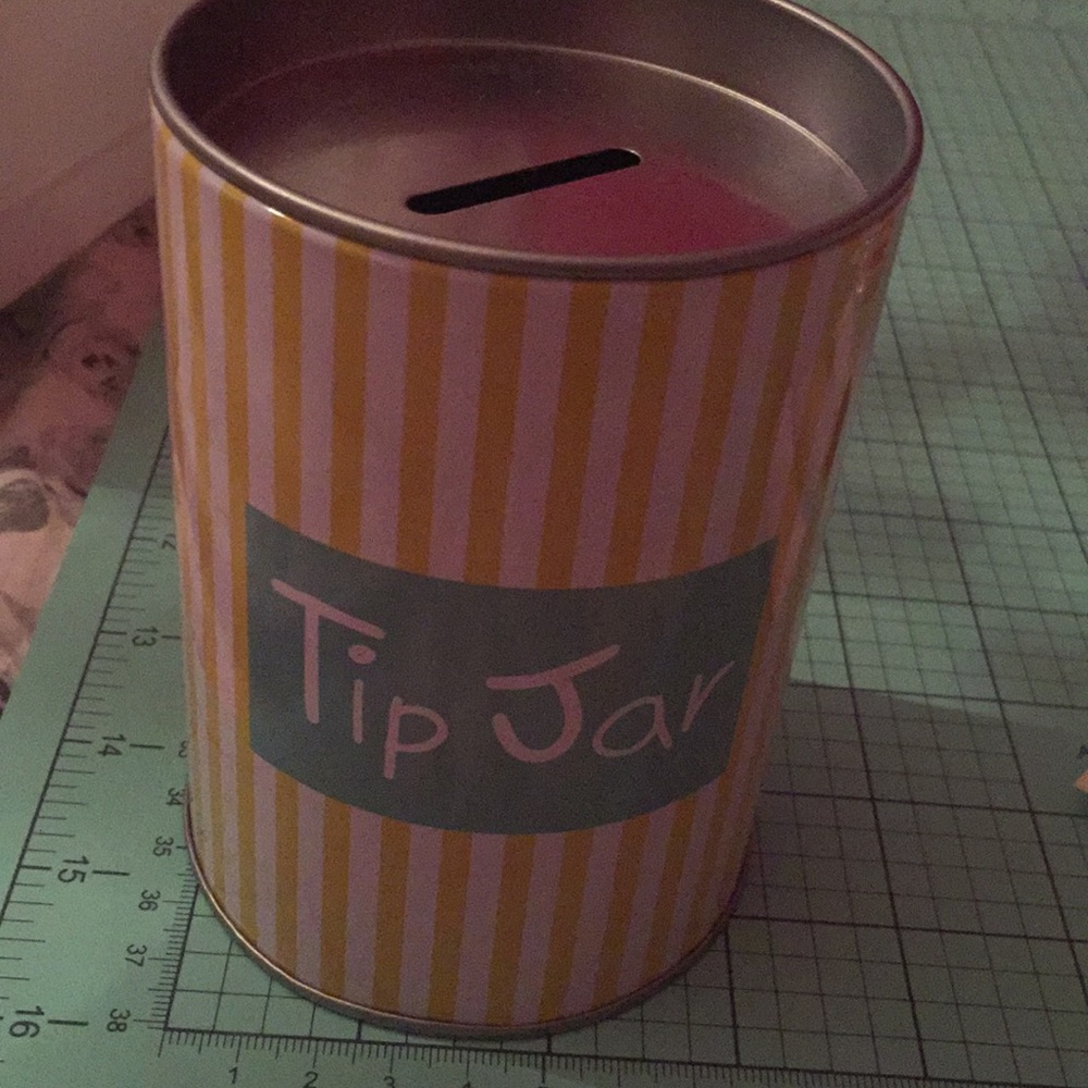Tip jar can. Yellow and white striped